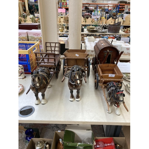 505 - Three ceramic shire horses with wooden carts together with one handmade Romany Rose gypsy caravan