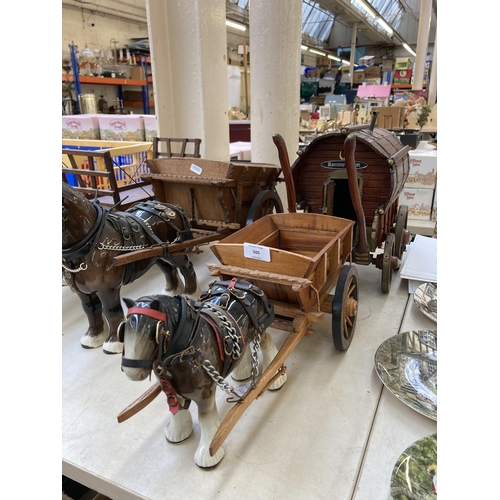 505 - Three ceramic shire horses with wooden carts together with one handmade Romany Rose gypsy caravan