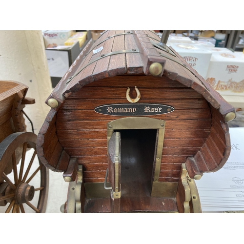 505 - Three ceramic shire horses with wooden carts together with one handmade Romany Rose gypsy caravan