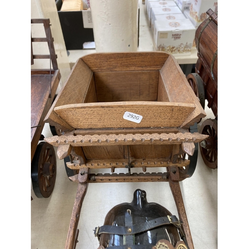 505 - Three ceramic shire horses with wooden carts together with one handmade Romany Rose gypsy caravan