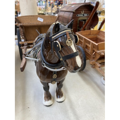 505 - Three ceramic shire horses with wooden carts together with one handmade Romany Rose gypsy caravan