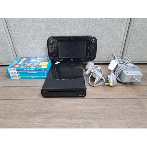 866 - A Nintendo WiiU WUP-101(03) console with gamepad, console, gamepad AC adapter and four games; Pikmin... 