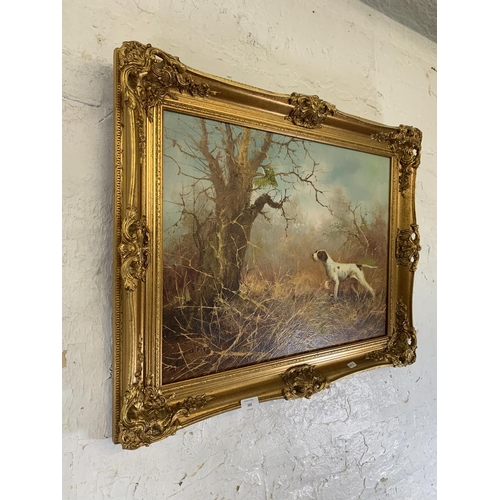 283 - A mid 20th century gilt framed oil on board of a dog hunting scene signed J. Fitz lower left - appro... 