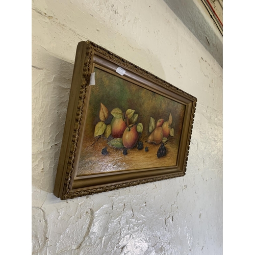 289 - A mid 20th century gilt framed oil on board still life of fruit by Coalport artist Joseph Mottram, s... 