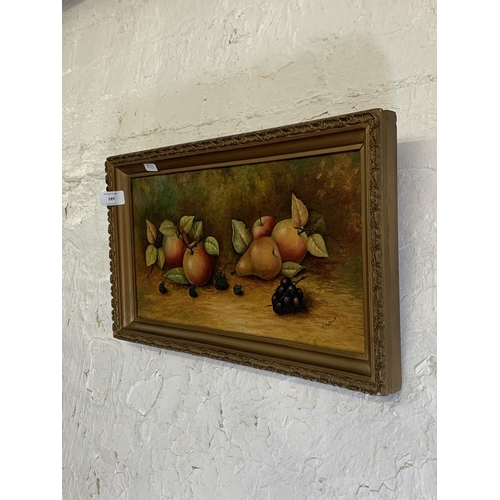 289 - A mid 20th century gilt framed oil on board still life of fruit by Coalport artist Joseph Mottram, s... 