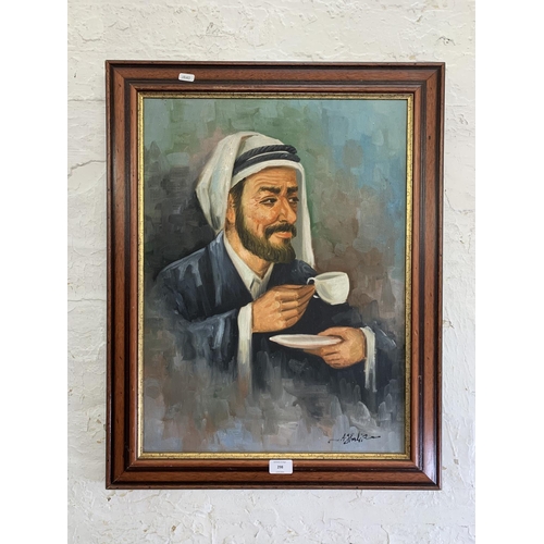 298 - A 20th century framed acrylic on canvas portrait of a Middle Eastern gentleman signed lower right - ... 