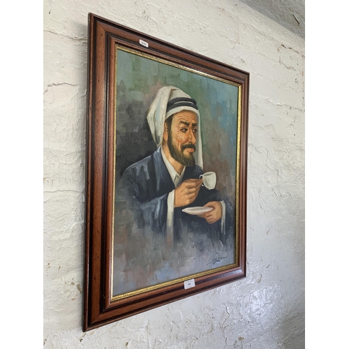 298 - A 20th century framed acrylic on canvas portrait of a Middle Eastern gentleman signed lower right - ... 