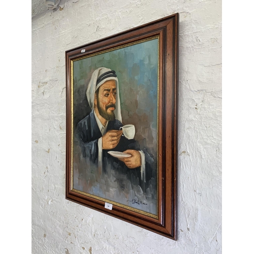 298 - A 20th century framed acrylic on canvas portrait of a Middle Eastern gentleman signed lower right - ... 