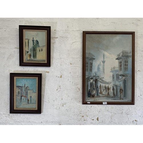 300 - Three mid 20th century Middle Eastern street scene framed paintings - largest approx. 70cm high x 50... 