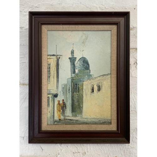 300 - Three mid 20th century Middle Eastern street scene framed paintings - largest approx. 70cm high x 50... 