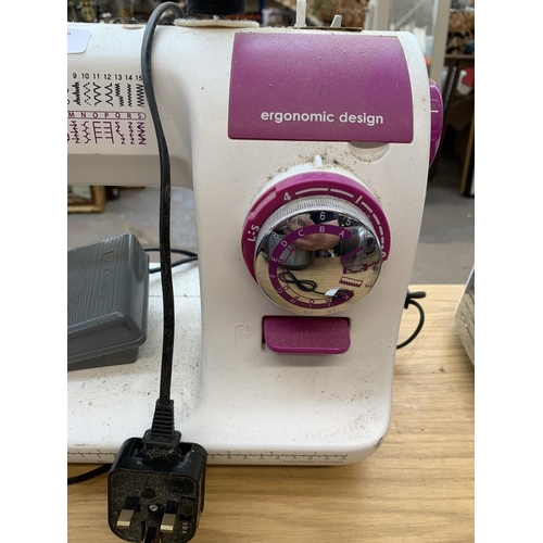 930 - A Toyota SP20 Series ECO34A electric sewing machine with foot pedal