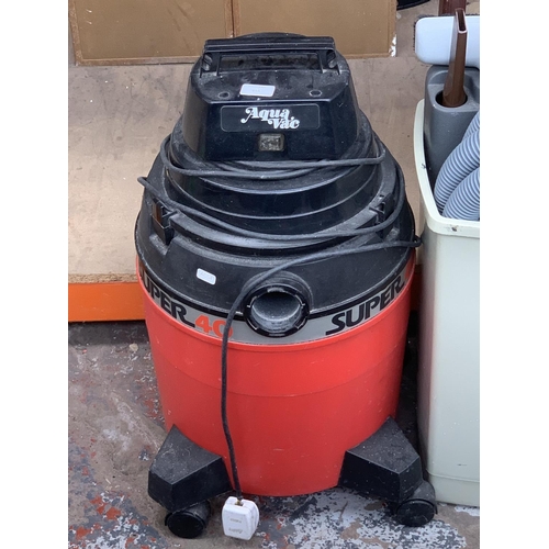 944 - An Aquavac Super 40 wet and dry vacuum cleaner with attachments