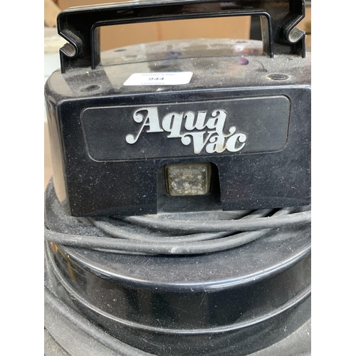 944 - An Aquavac Super 40 wet and dry vacuum cleaner with attachments