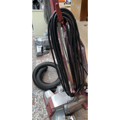 947 - A Kirby Legend II upright vacuum cleaner with attachments