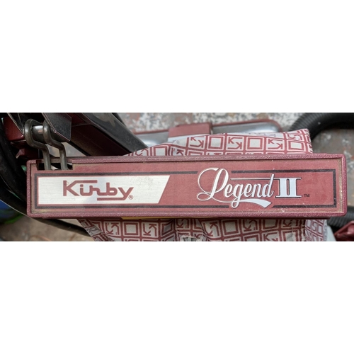 947 - A Kirby Legend II upright vacuum cleaner with attachments