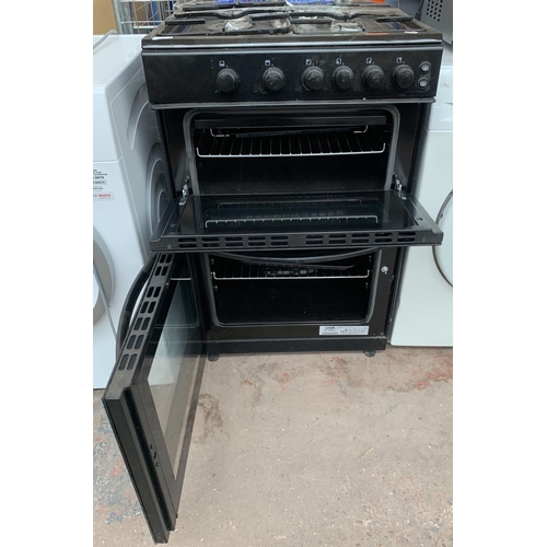 959 - A Logik two oven, four burner hob 60cm freestanding gas cooker