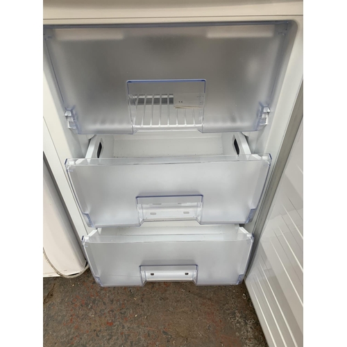 969 - A Beko 55cm under counter freezer