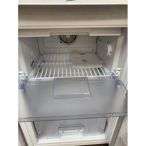 969 - A Beko 55cm under counter freezer