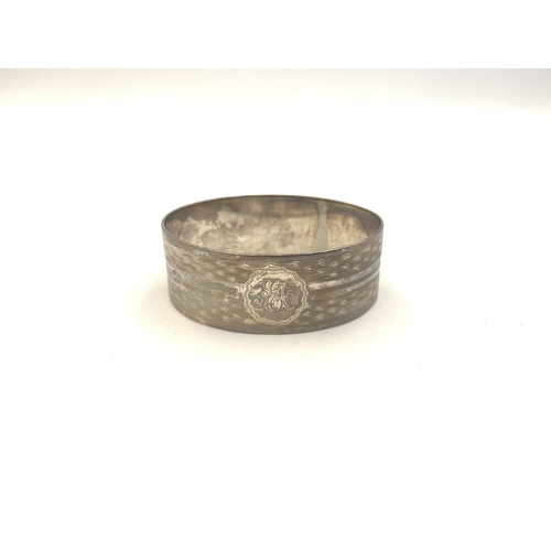 2134 - Three pieces of hallmarked silver, one Birmingham napkin ring, one Victorian William Aitken Chester ... 