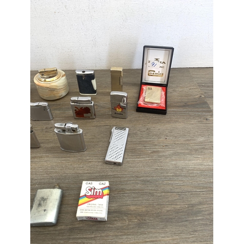 2144 - A collection of vintage table and cigarette lighters to include Cosmic, Ronson, Rowenta etc.