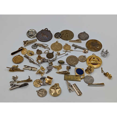 2145 - A collection of various military cufflinks, necklace pendants, coins and tie clips