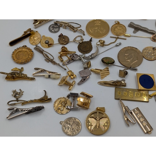 2145 - A collection of various military cufflinks, necklace pendants, coins and tie clips