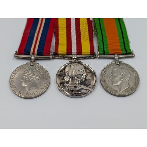 2146 - Three WWII British medals, one Defence presented to R. Litherland, one War and one Voluntary Medical... 