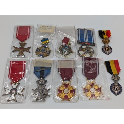 2147 - Ten military medals to include Belgian Order of Leopold II Knights Cross, Ukrainian Police Troops, P... 