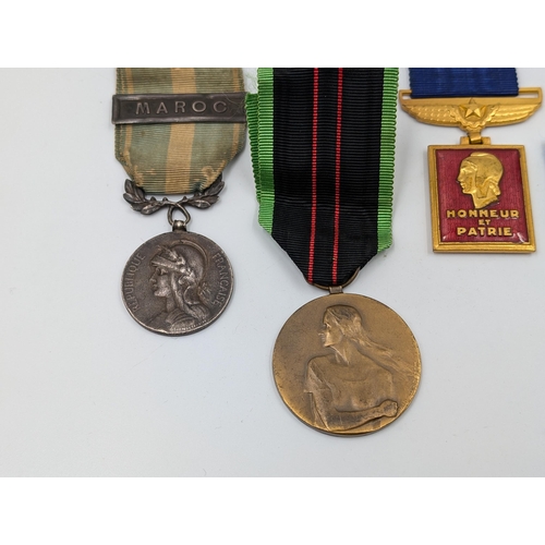 2158 - Five military medals to include Belgian Resistance, French Medaille Coloniale etc.