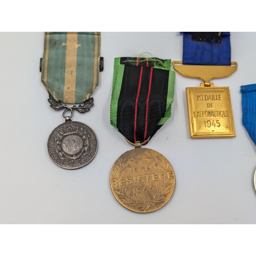 2158 - Five military medals to include Belgian Resistance, French Medaille Coloniale etc.