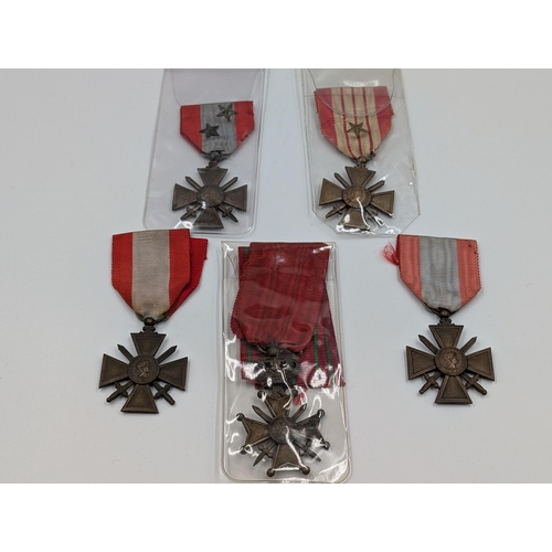 2159 - Five WWII Croix de Guerre military medals, four French and one Belgian