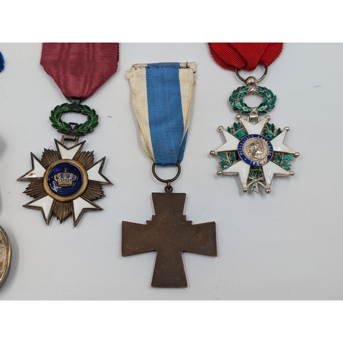 2161 - Five military medals, one Finnish Civil Guard Cross, one Order of Saint John, one Belgian Order of L... 