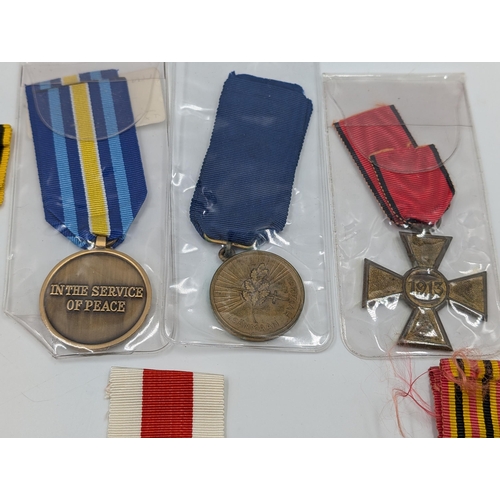 2168 - Ten military medals to include Italian Victory, Belgian Commemorative, Serbian Cross for Courage etc... 