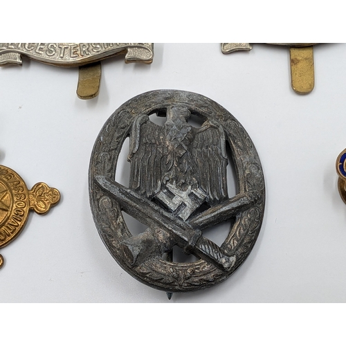 2177 - Five military items, two Leicestershire cap badges, one The St. John Ambulance Association medal pre... 