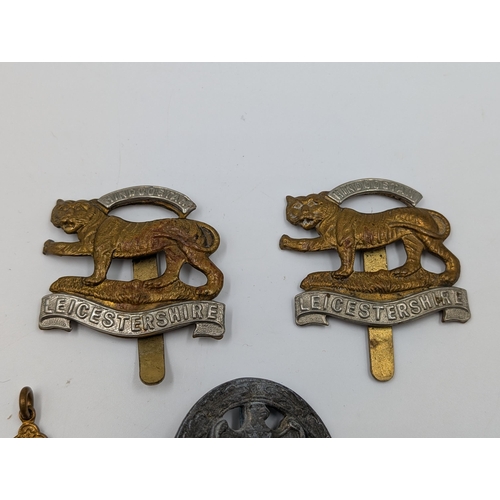 2177 - Five military items, two Leicestershire cap badges, one The St. John Ambulance Association medal pre... 