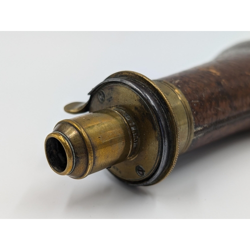 2178 - A 19th century brown leather and brass gun powder flask - approx. 20cm long