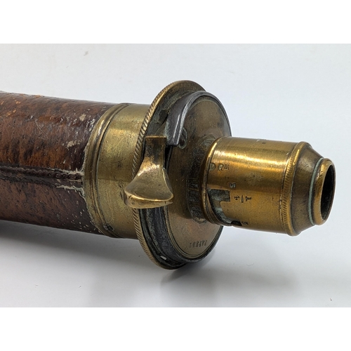 2178 - A 19th century brown leather and brass gun powder flask - approx. 20cm long