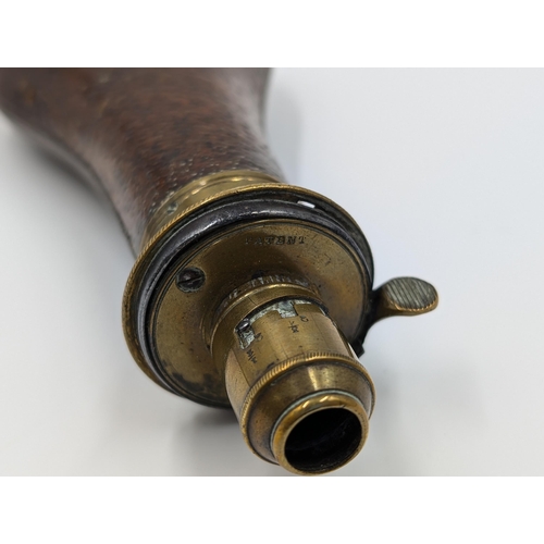 2178 - A 19th century brown leather and brass gun powder flask - approx. 20cm long