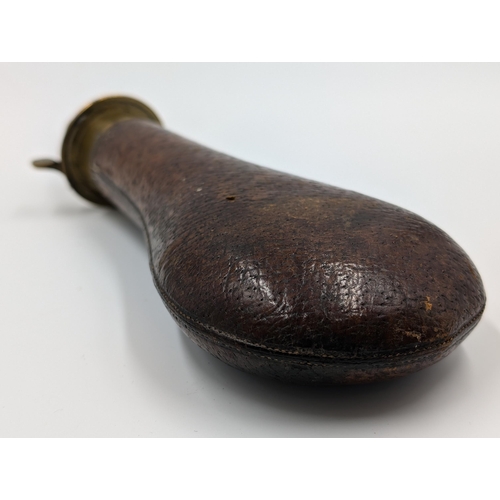 2178 - A 19th century brown leather and brass gun powder flask - approx. 20cm long