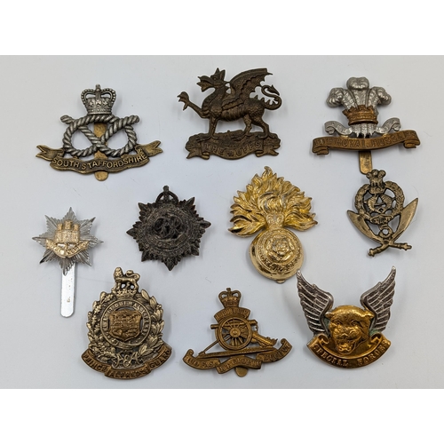 2184 - Ten military cap badges