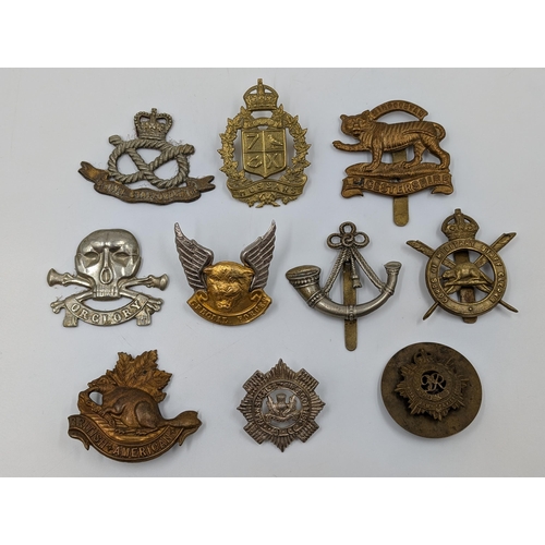 2186 - Ten military cap badges