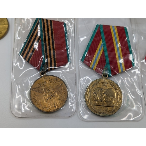 2211 - Ten military medals to include German Long Service, Russian 100 Years Anniversary Medal etc.