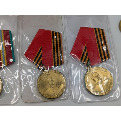 2211 - Ten military medals to include German Long Service, Russian 100 Years Anniversary Medal etc.