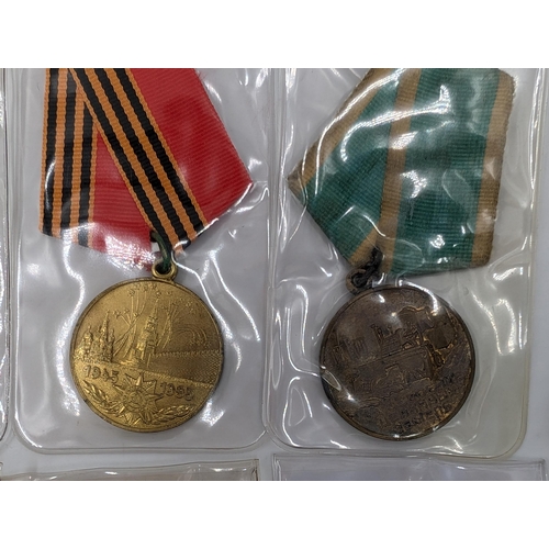 2211 - Ten military medals to include German Long Service, Russian 100 Years Anniversary Medal etc.