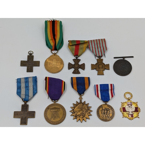 2218 - Ten military medals to include WWI Italian War Merit Cross, 1980 Zimbabwe Independence, U.S. Air For... 