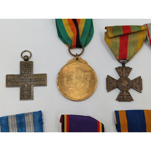 2218 - Ten military medals to include WWI Italian War Merit Cross, 1980 Zimbabwe Independence, U.S. Air For... 