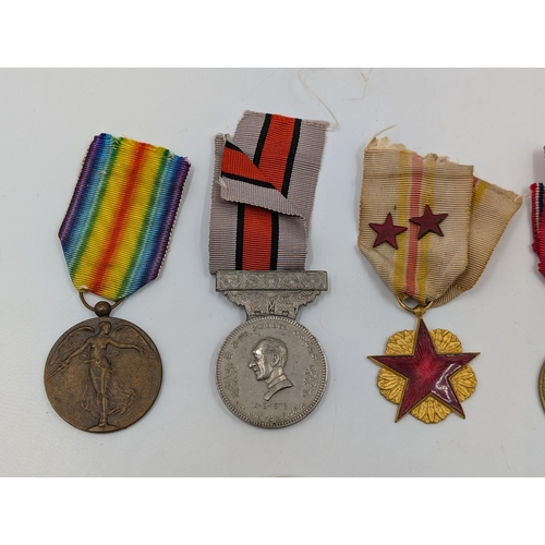 2219 - Ten military medals to include Belgian WWI Croix de Feu, Czechoslovakian Revolution Cross, Portugues... 