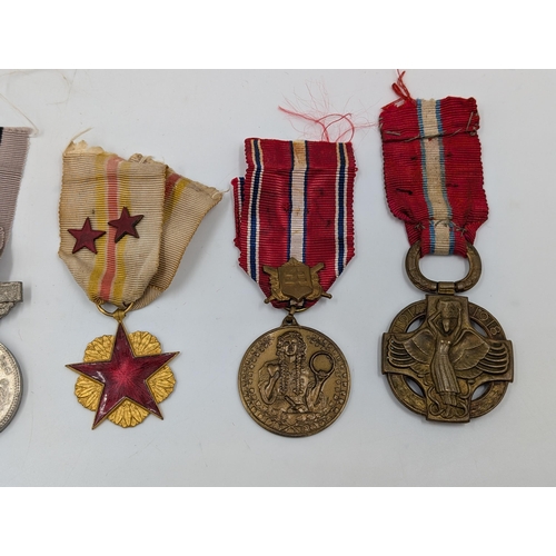 2219 - Ten military medals to include Belgian WWI Croix de Feu, Czechoslovakian Revolution Cross, Portugues... 