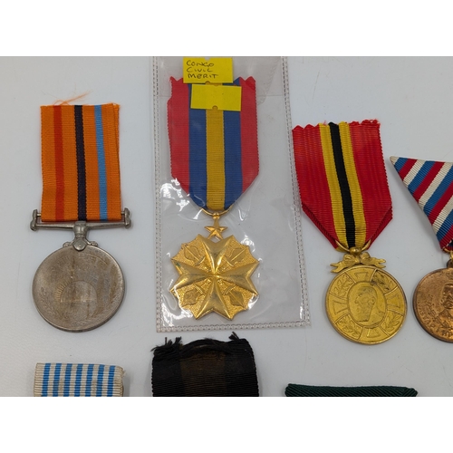 2220 - Ten military medals to include WWI Belgian Yser, Congo Civil Merit, U.S. Navy Armed Forces etc.