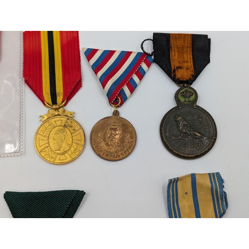 2220 - Ten military medals to include WWI Belgian Yser, Congo Civil Merit, U.S. Navy Armed Forces etc.